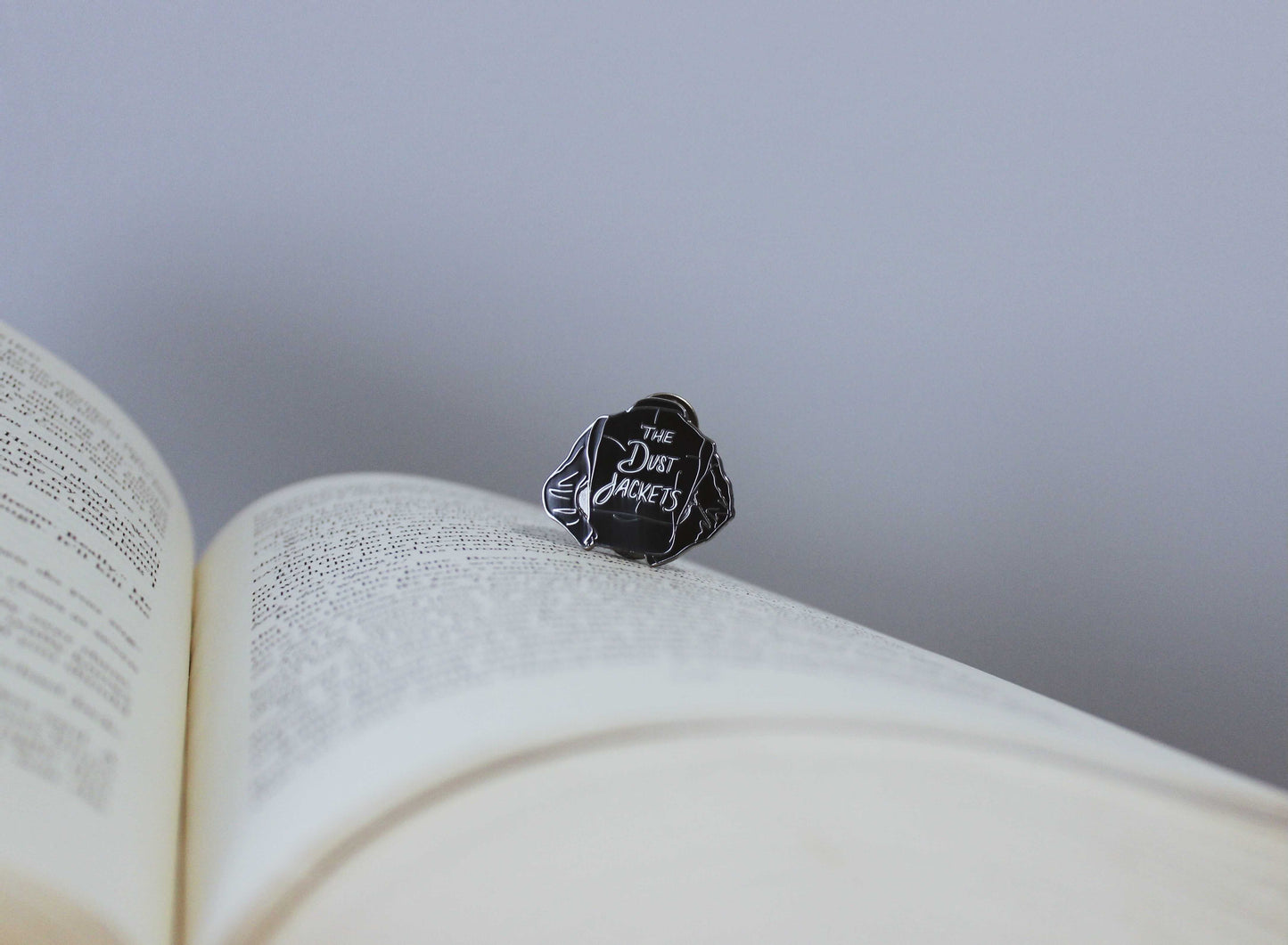 The Dust Jackets Enamel Pin